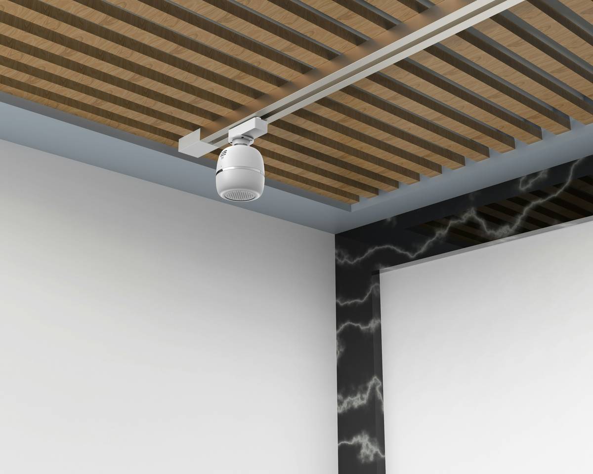 Decorative track lighting systems installed in a minimalist living room with adjustable spotlights highlighting wall art and a reading nook